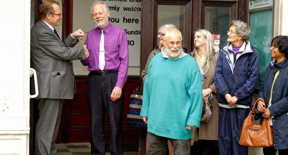 Handing over the key for the huge new church building