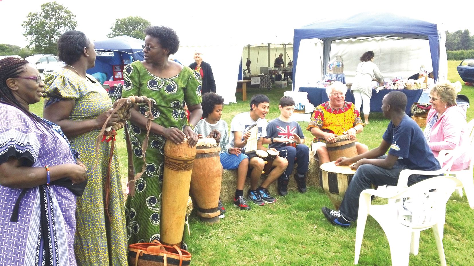 Farmfest exhibitors and visitors enjoying drumming