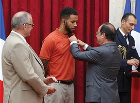 Anthony Sadler (left) was given the prestigious Legion of Honour for bravery by French President Francois Hollande