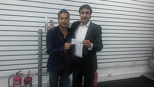 Wilson Chowdhry (left) gave  a donor cheque to Nissar  Hussain on behalf of the British Pakistan Christian Association.  A few weeks later, he would be  savagely beaten and end up in  hospital with a broken hand and  kneecap and extensive bruising.  The attack was only stopped when a passer-by came to help Nissar