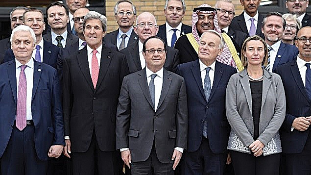 President Hollande, centre, fronts the Paris ‘peace’ conference with former US Secretary of State John Kerry, centre left