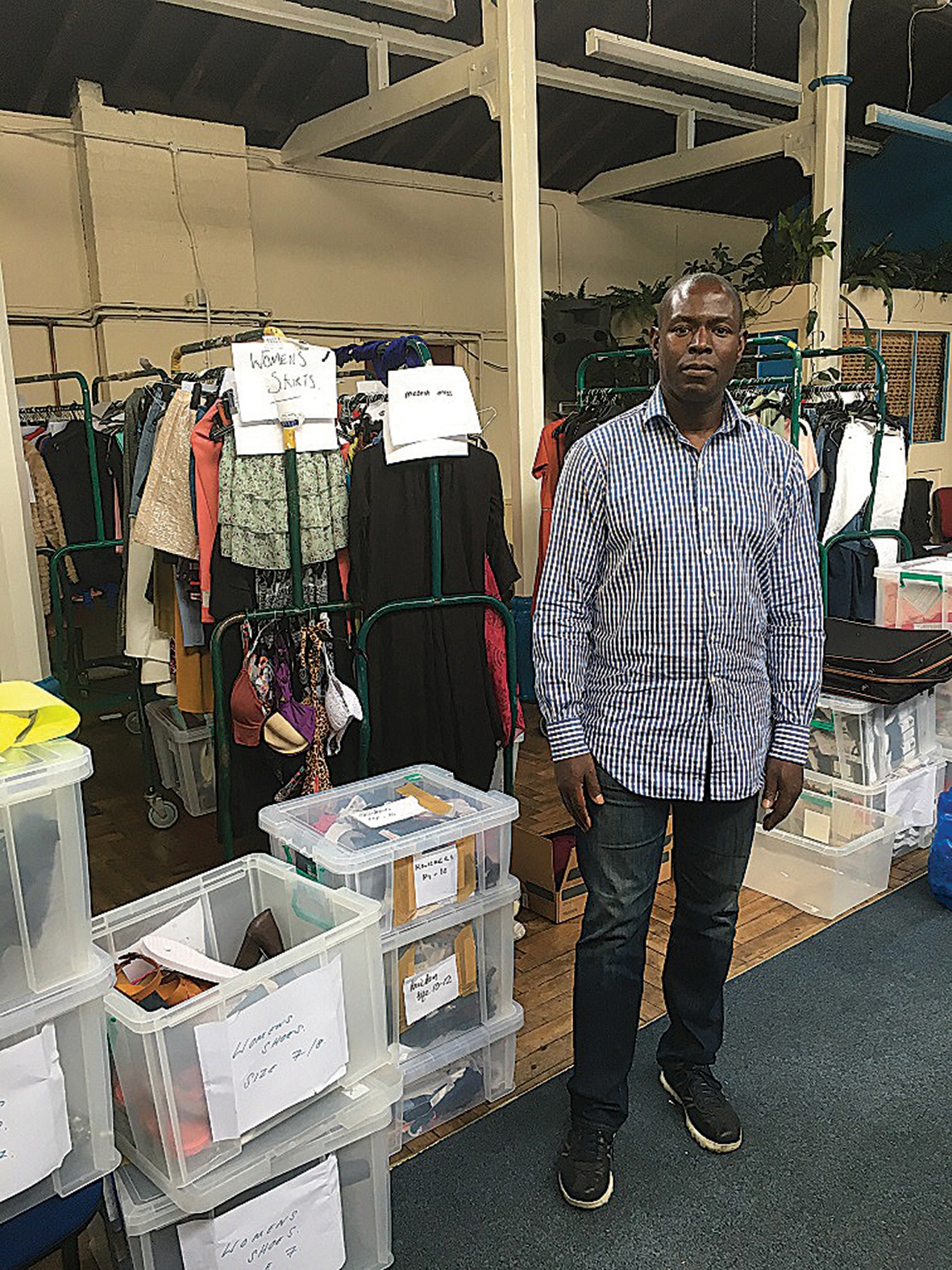 Forewarned: Pastor Derrick Wilson with donated goods after he had been warned to prepare for an influx of people 