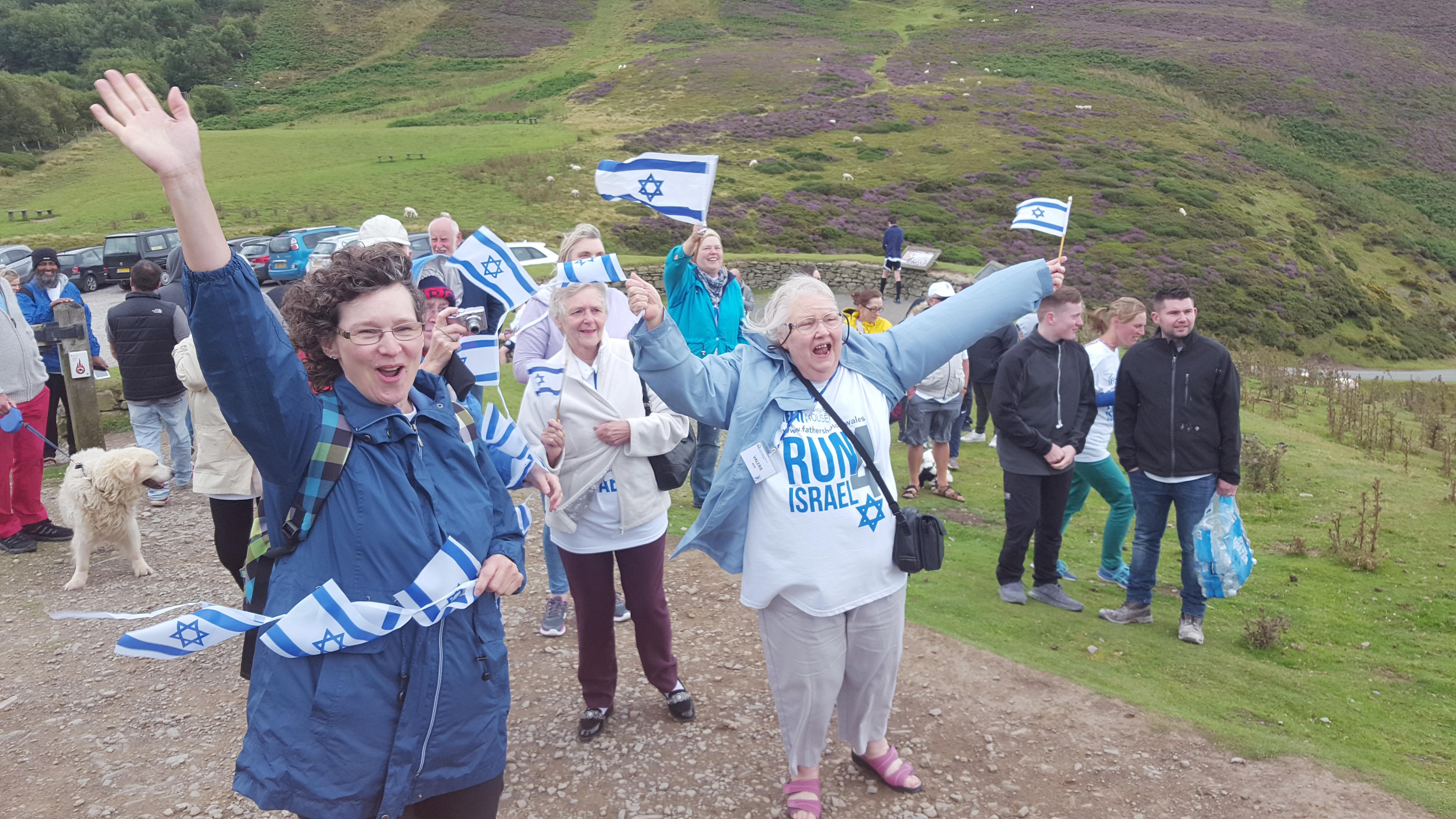 In an event organised by the Father’s House Sabbath congregation at Shotton, Deeside, cheerleaders greet 80 intrepid runners as they complete 8km along the Clwydian range in North Wales to demonstrate Christian support for Israel