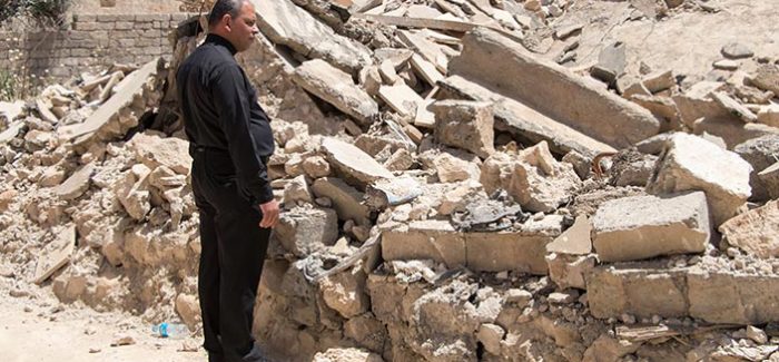 Father Thabet, a church leader in Karamles, surveys the rubble (Credit: Open Doors) Persecution Watch Oct – Nov 2017