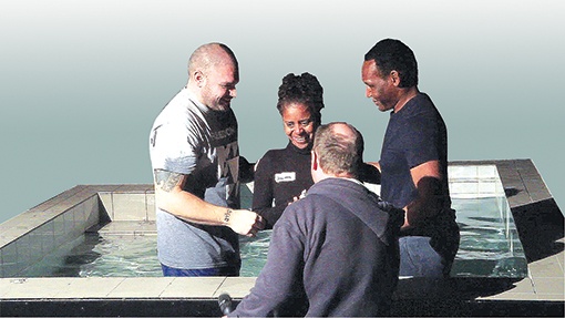 Brigitta Jaffar is baptised at church by Pastor Rohan Andrew (right)
