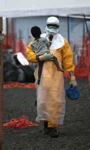 A Doctor carrying a Congolese child
