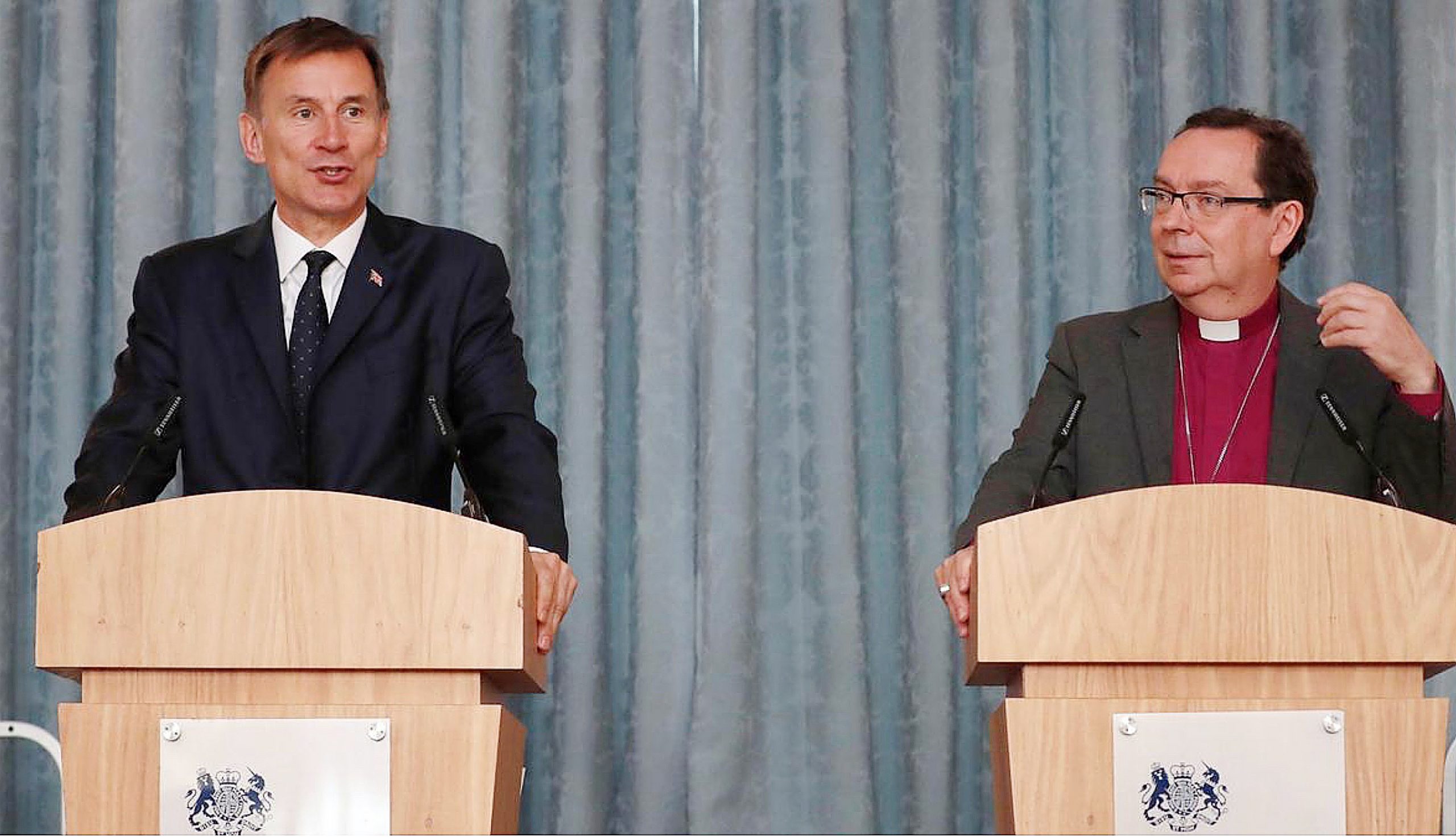 Jeremy Hunt shares a podium with the bishop