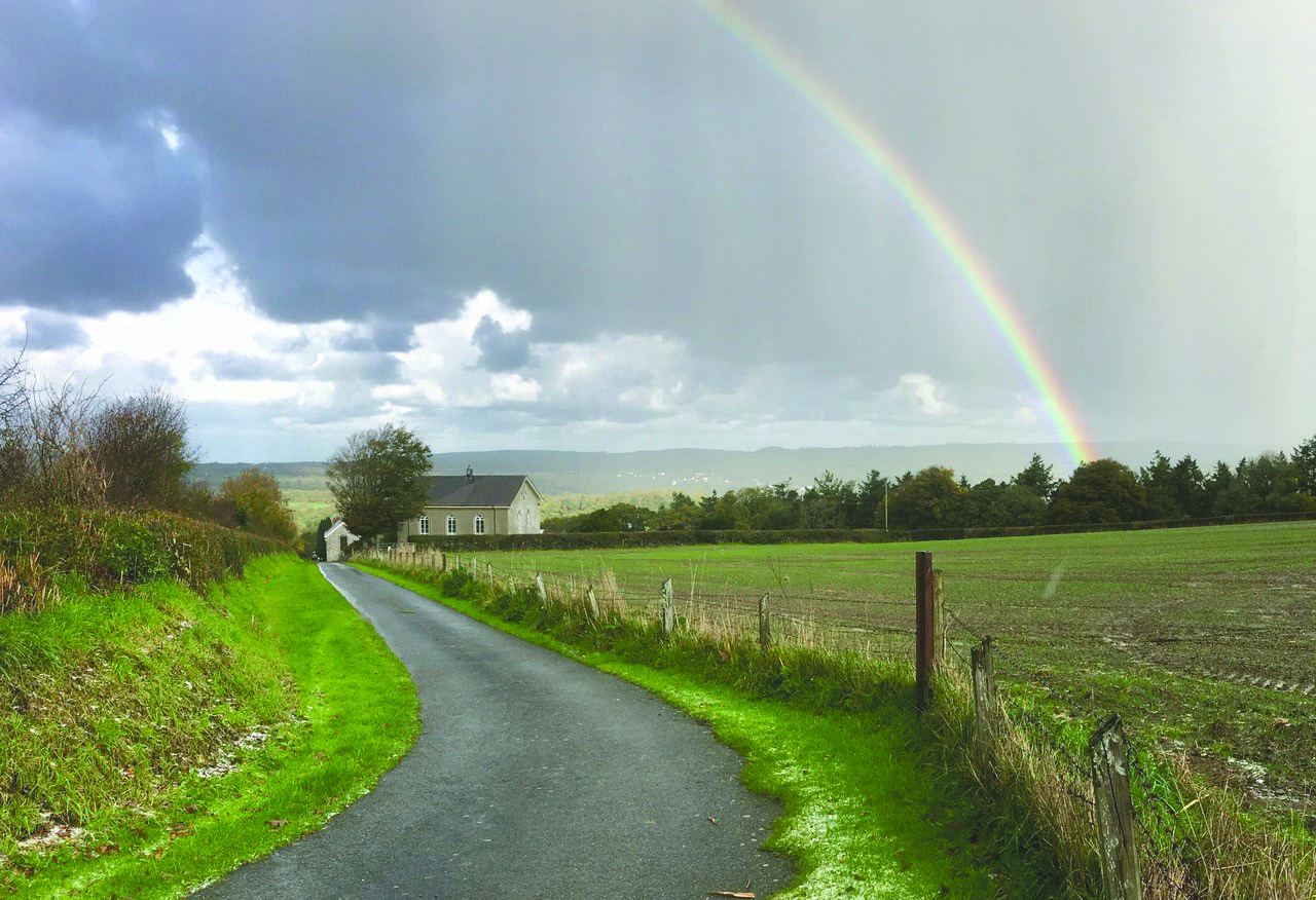 A rainbow of hope hovers over a remote Welsh chapel