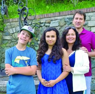 Happier times: Natasha with brother Alex and parents Tanya and Nadim Natasha with brother Alex and parents