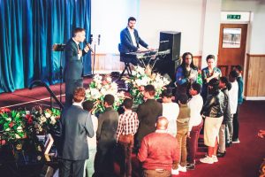 Young people coming to give their lives to Jesus at a Vinesong concert