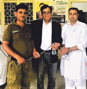Asif Pervaiz (right) with lawyer Saiful Malook (centre) at prison