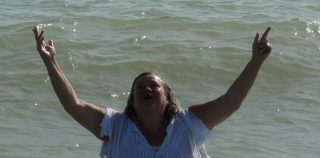 Rebirth: Lissy’s joy after her old life vanished beneath the waves Beach baptism joy