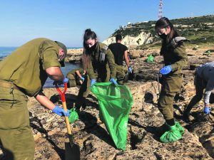 IDF soldiers help with the clear up