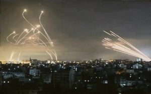 This graphic photo shows rockets fired at Israel’s civilians (right), while the formidable Iron Dome missile defence system knocks them out (left). Due to the frequency of the Iran-made rockets in the latest attacks, the Iron Dome only succeeded in averting 90% of the missiles