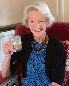 Raising a glass of something healthy, Margaret McDermott celebrates her survival