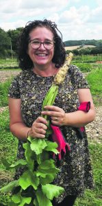 Tracey Wickland with one of the smaller parsnips