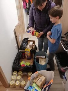 A little boy and his mother select donated food