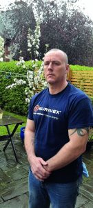 Bruce in blue Survivex T shirt