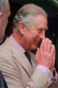 King Charles Smiling and "Praying"
