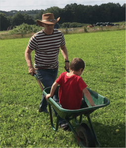 Chris Wickland pushing his son