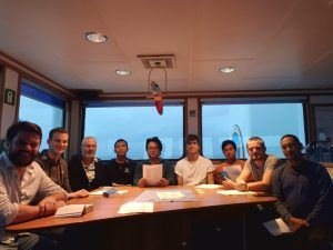 The Dutch captain of the Liamere, left, with his international crew