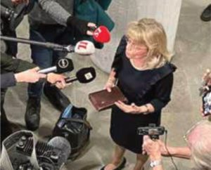 Päivi Räsänen holds a Bible while defending her faith