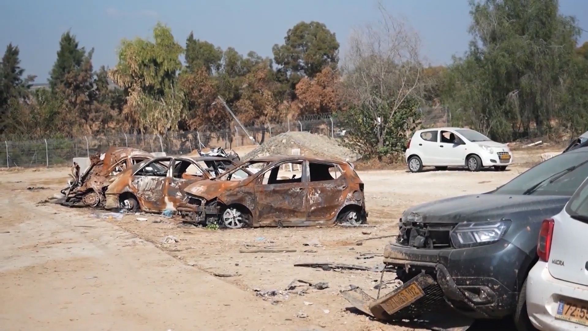 Burnt out cars in Kfar Aza Kibbutz after the 7 October attack