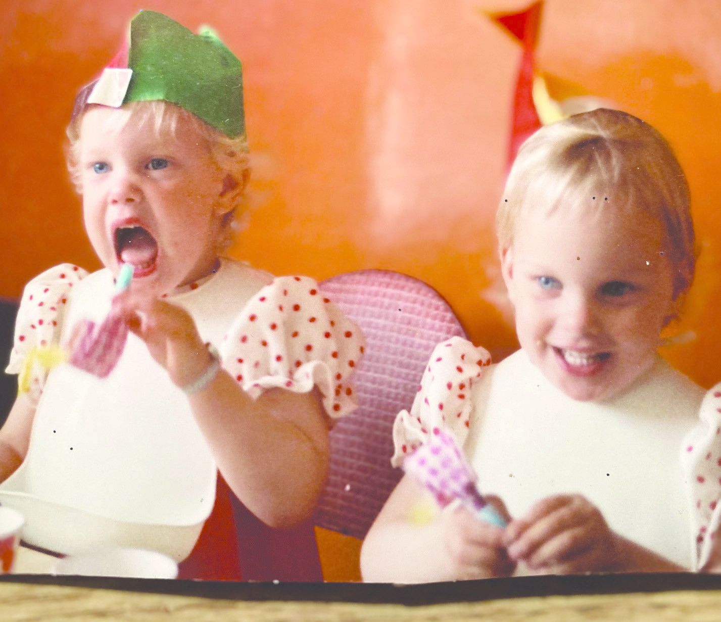 Victoria with twin sister Bella, aged two