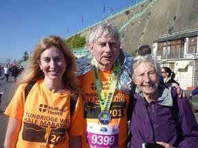 Jonathan with his wife and daughter after the 2019 Brighton marathon